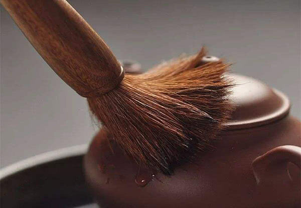 Clean the teaware with a soft brush